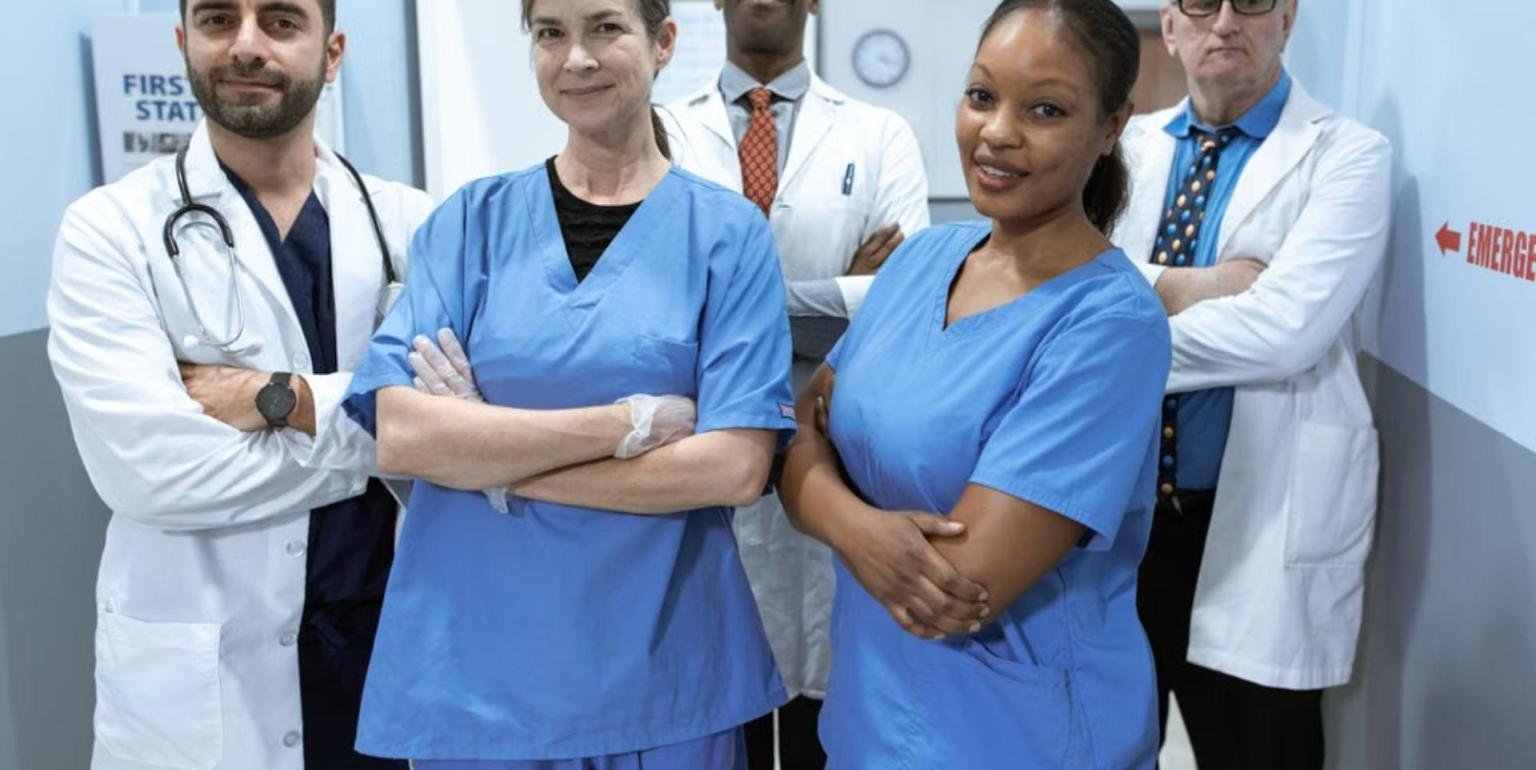 Diverse team of healthcare professionals standing together confidently